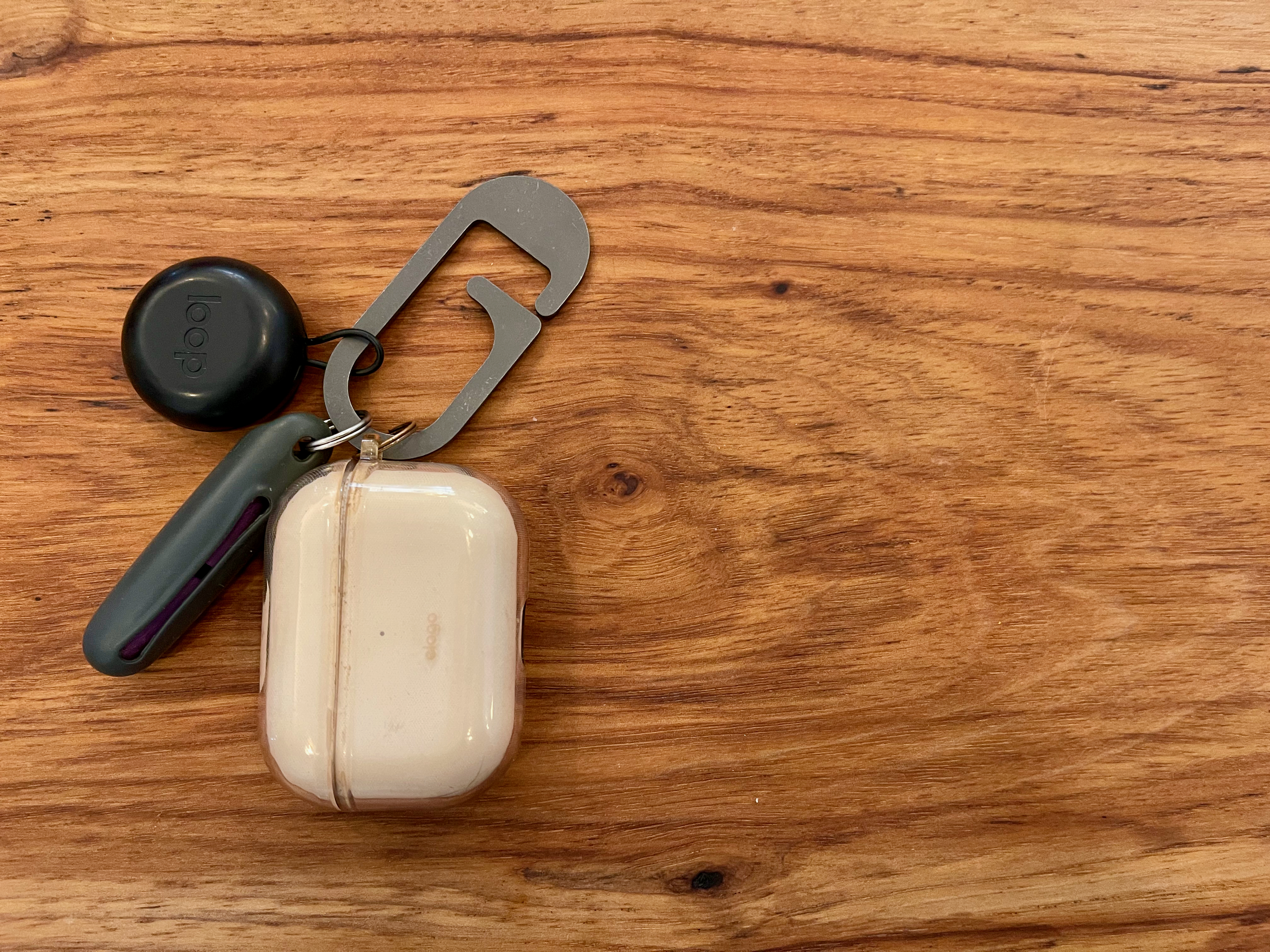 Sensory kit on a clip: @matadorequipment ear plug case with Mack's slim fit ear plugs, @apple AirPods Pro, and @loopearplugs concert ear plugs all dangling from a @jrwgear G-Flex clip