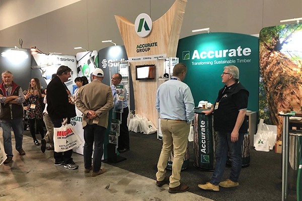 Accurate Group tradeshow stand with attendees | Stirling Machinery