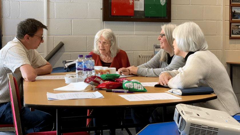 Members talking at a planning meeting in 2021