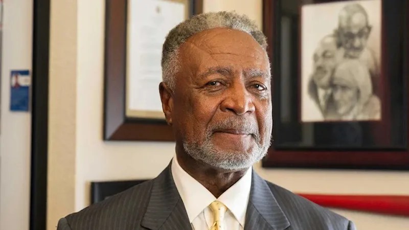 Portrait of Frank White Jr., former Jackson County executive, wearing a suit and tie, with a calm expression in an office setting.