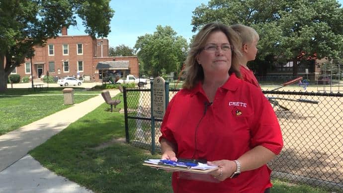 Crete Public Schools mom Mishelle Kortus, with her petition. (Photo courtesy of 1011 Now News.)