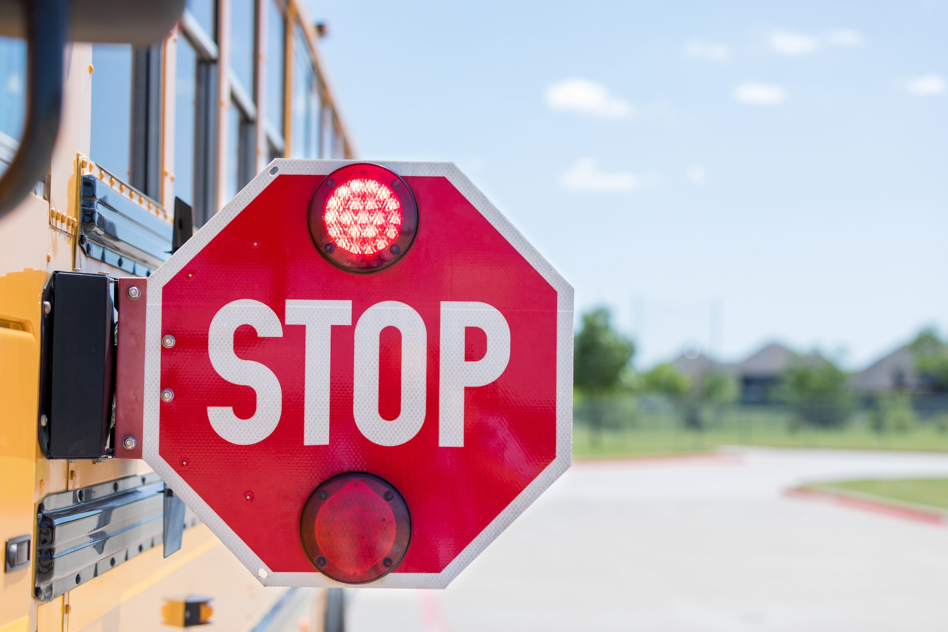 When the stop arm is extended and the lights are flashing, drivers must stop to keep children safe.