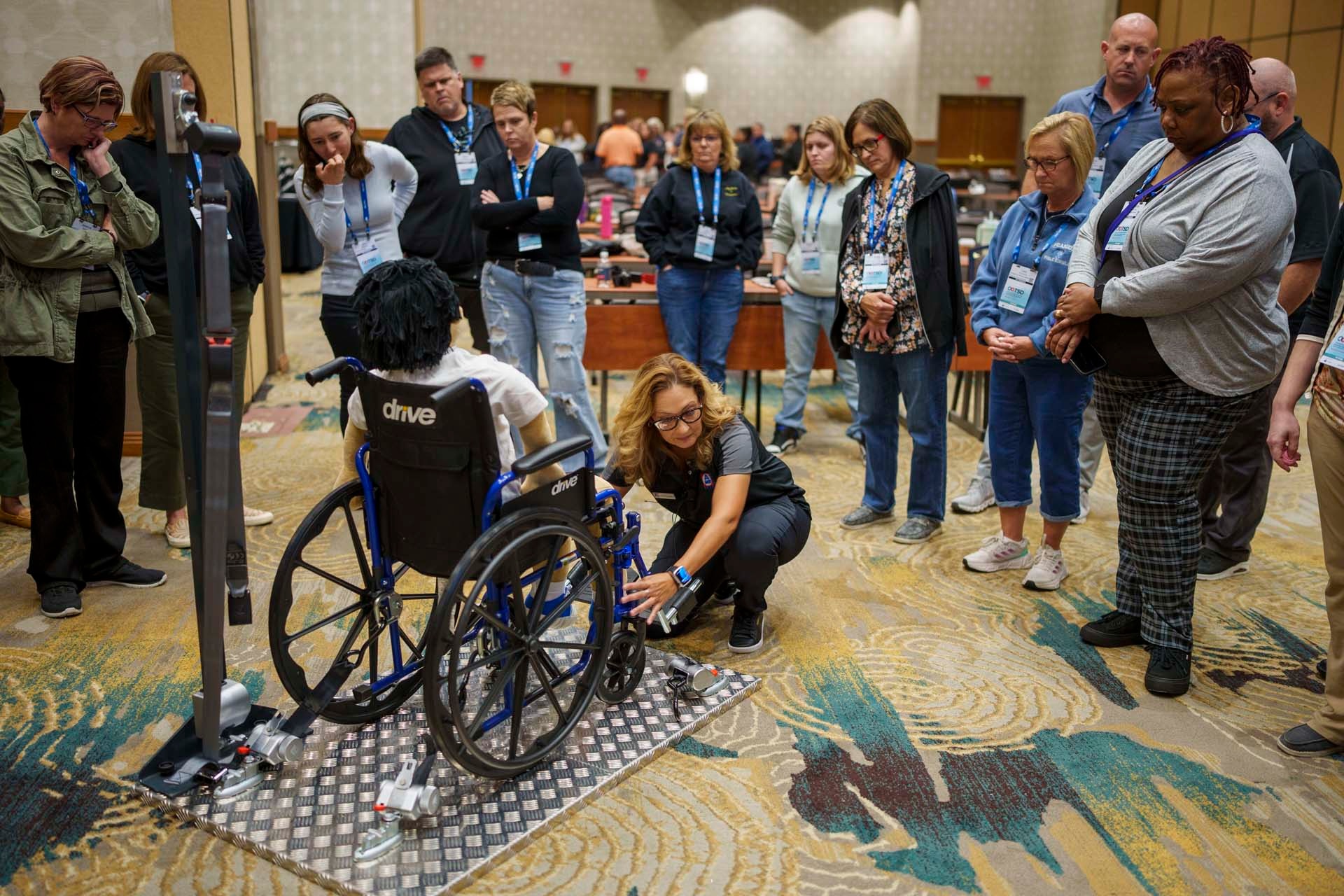 Maritza Valentin instructs attendees at the Wheelchair Securement Boot Camp Training & Certification hosted by AMF-Bruns of America at the 2024 TSD Conference (Photo by Vincent Rios Creative)