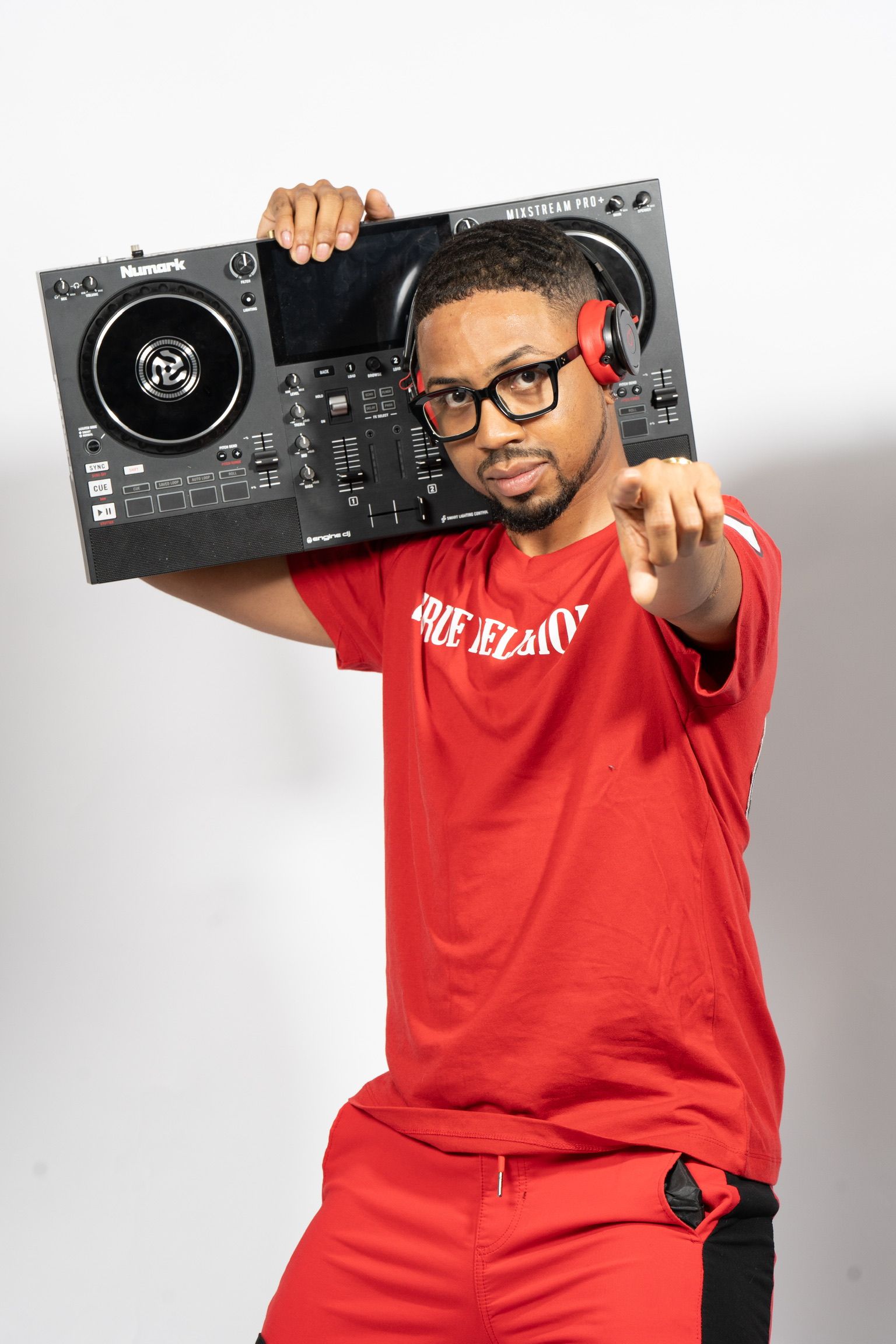 DJ Don Wan holding a DJ controller