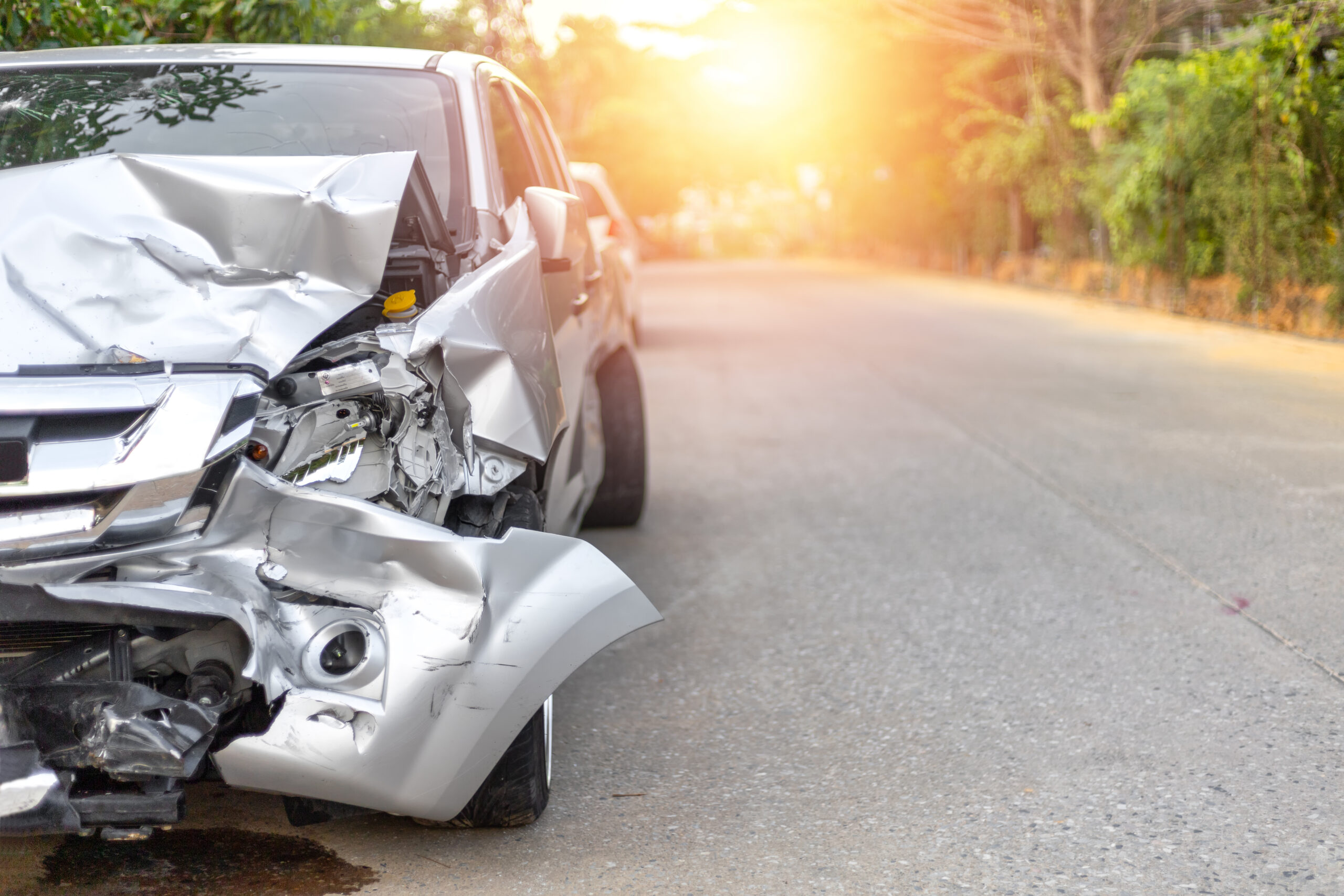 Front of light gray color car with pick up have big damaged and