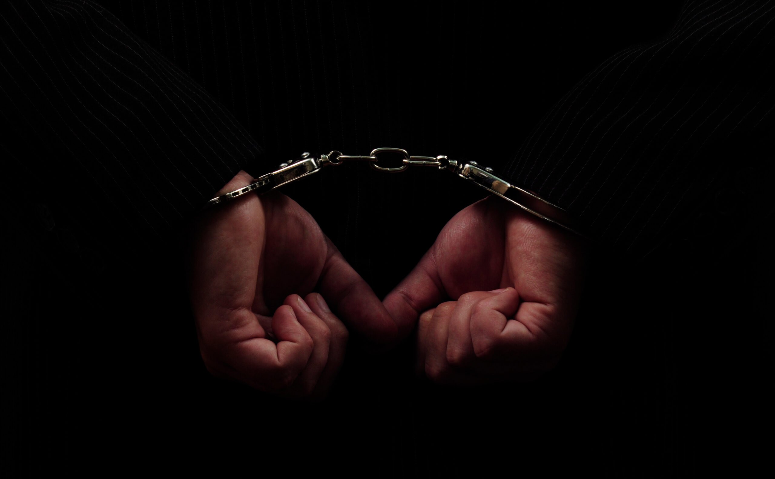 Hands in handcuffs