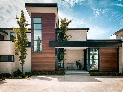 Garage conversion ADU featuring modern siding and separate entrance
