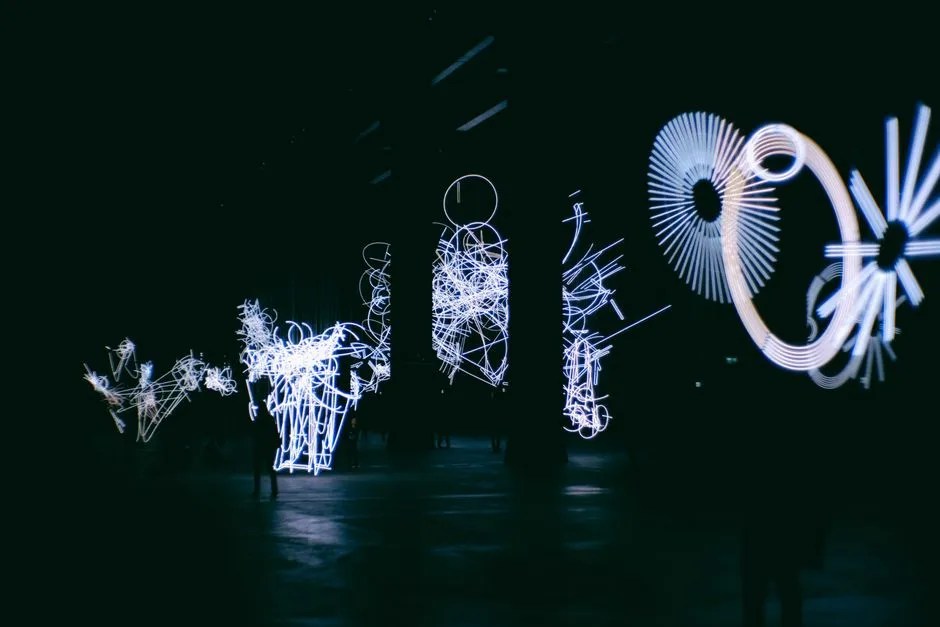 Neon geometric light installation at night, evoking the show's stark visual style