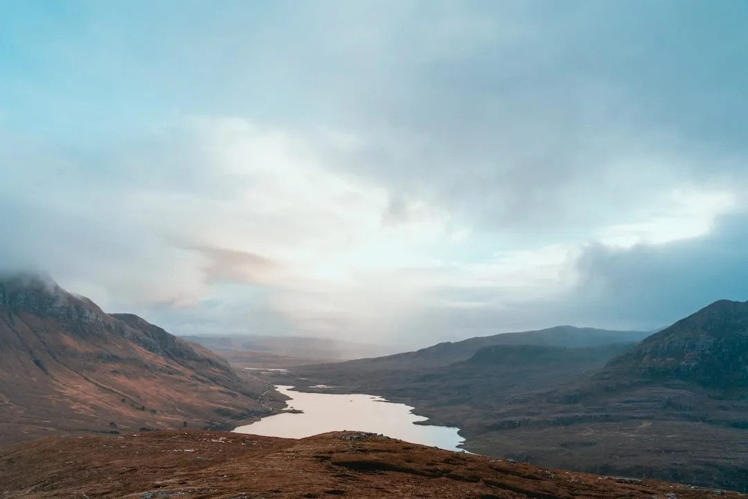 Scottish highlands and sky, a quiet landscape evoking the series' tone