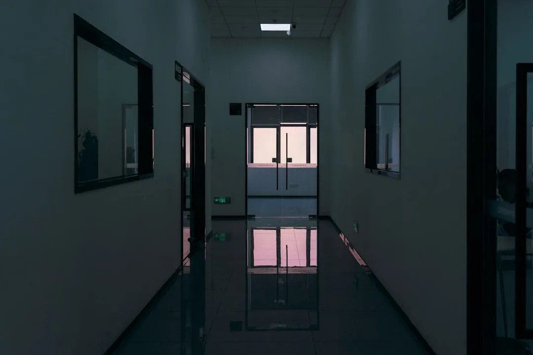Severance ending explained: a sterile fluorescent-lit office corridor evoking Lumon's corporate world