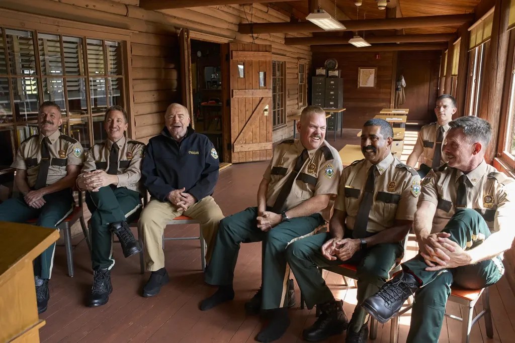 From L to R: Steve Lemme, Paul Soter, Brian Cox, Kevin Heffernan, Jay Chandrasekhar, Andrew Dismukes, and Erik Stolhanske in Super Troopers 3 (2026).