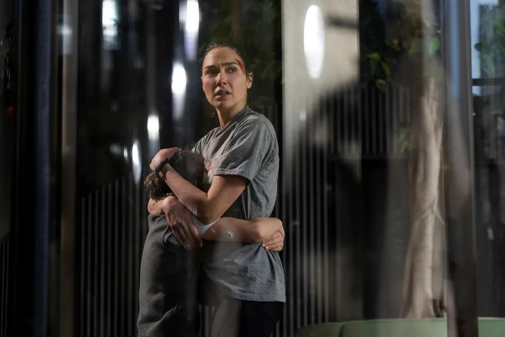 Rory Wilmot and Gal Gadot in The Runner (2026).
