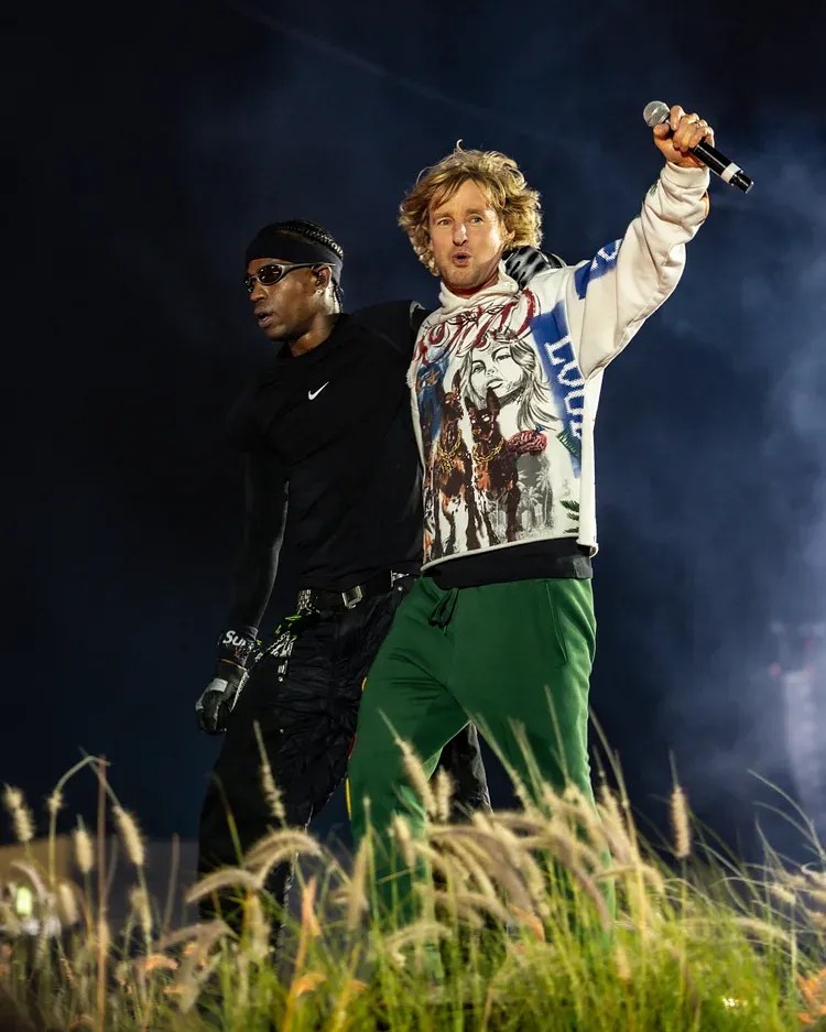 Travis Scott and Owen Wilson in Rolling Loud: The Movie (2026).