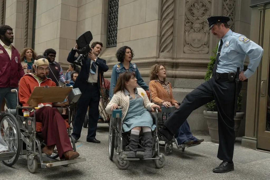 Andrew Pilkington, Siena Rafter, Charlie Rush-Reese, Dylan O’Brien, Roberta Colindrez, Ruth Madeley and Madeline Delp in Being Huemann (2026).