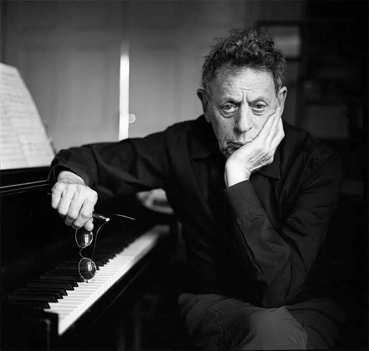 Philip Glass at piano black and white portrait