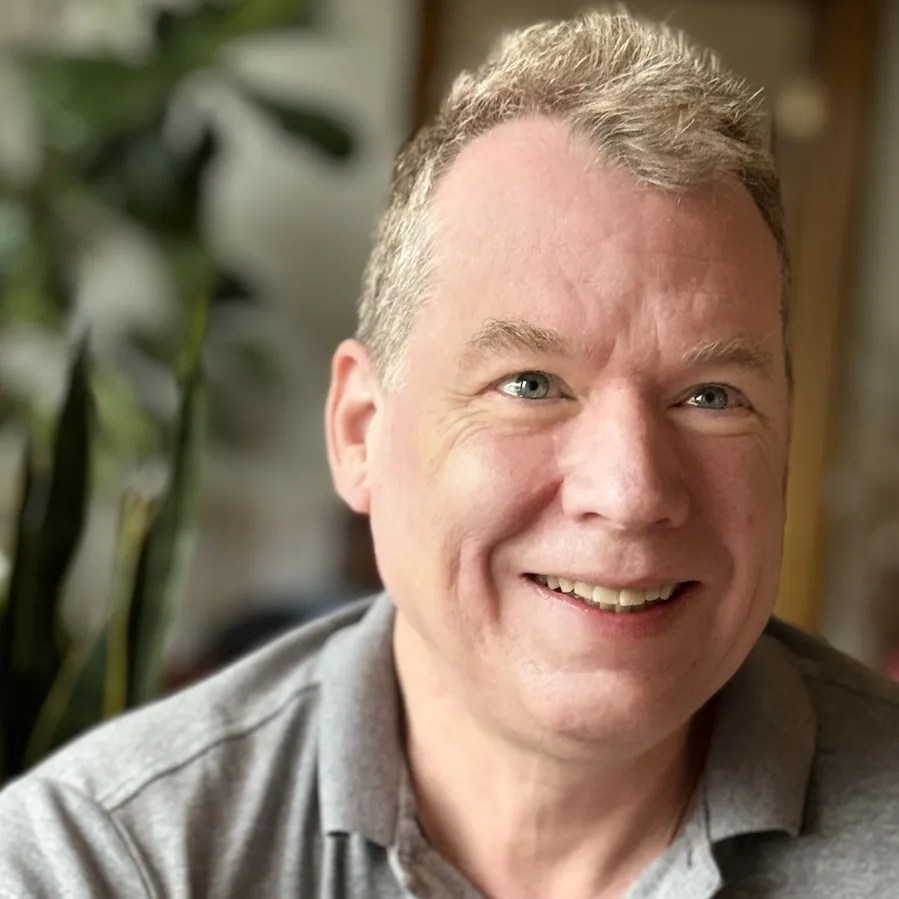 Headshot of music journalist and writer Thomas May