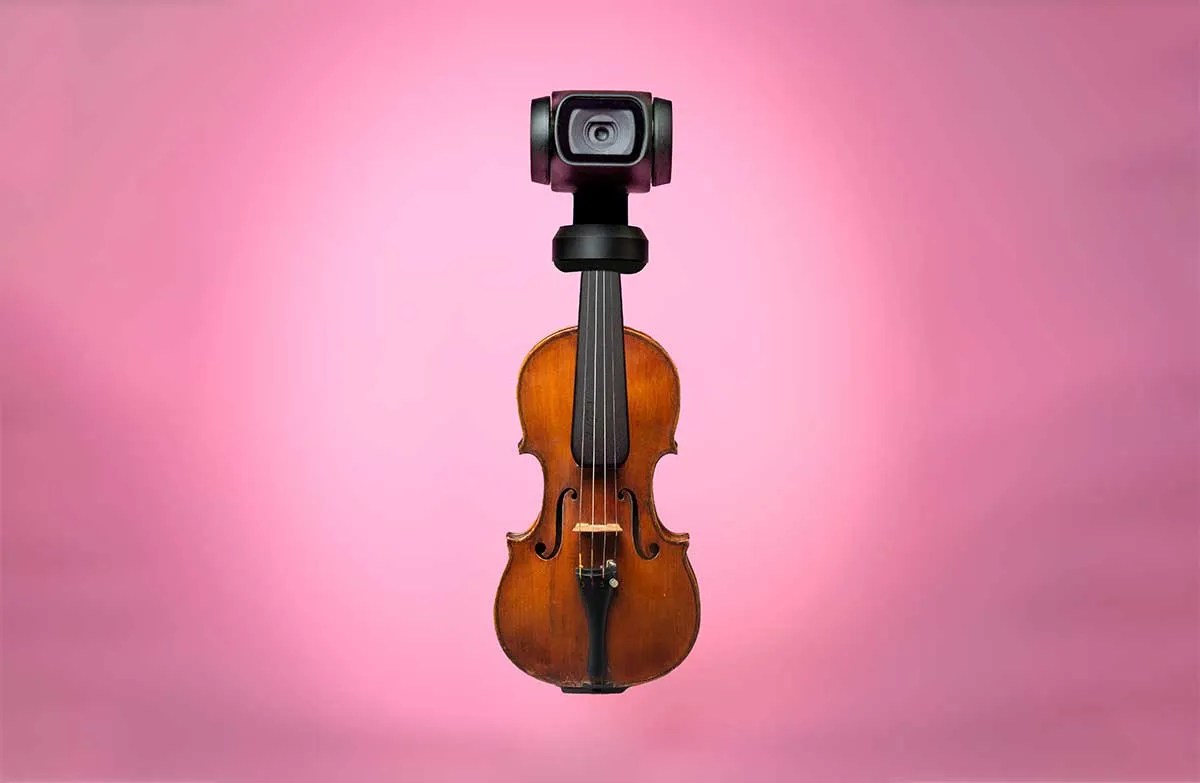 violin with camera attached to the scroll