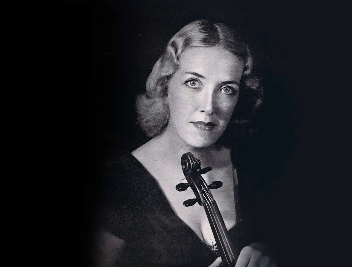 Black and white photo of Joan Field with violin, 1950, Wikimedia