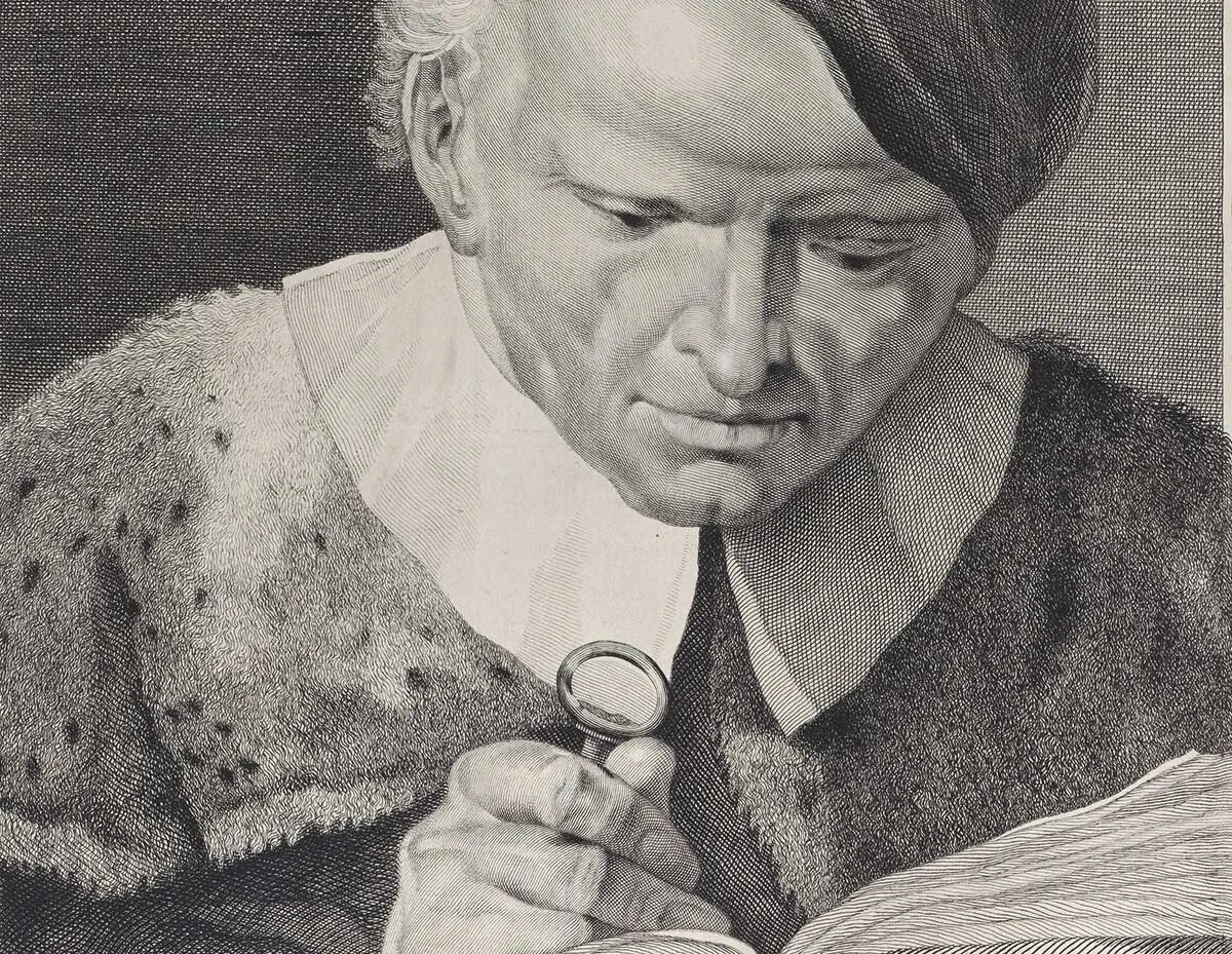 Etching of man reading book with magnifying glass, Illustration: Giovanni Cattini