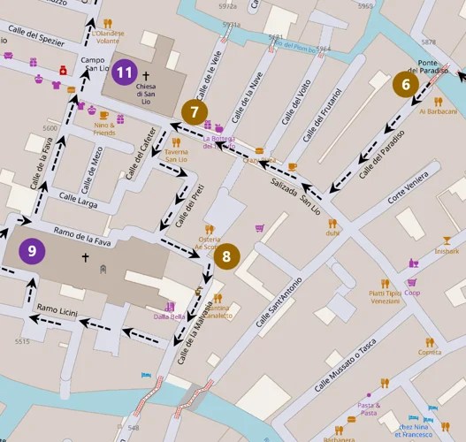 Map excerpt showing a walking route through a town with dashed black arrows and solid lines, stops labeled 6–11 in colored circles along the path, indicating a tour or scavenger-route.