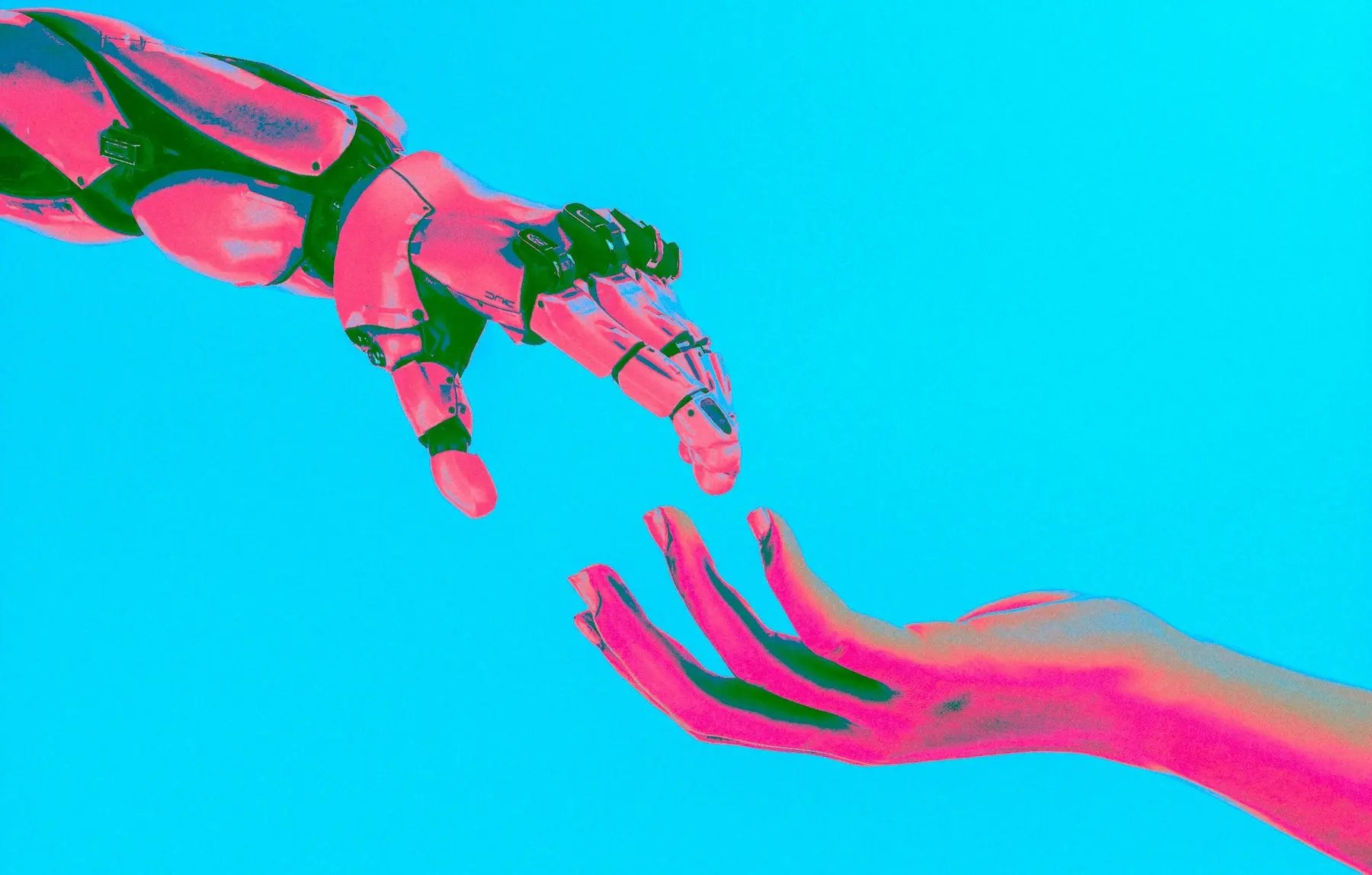 Representative image showing a robotic hand and a human hand