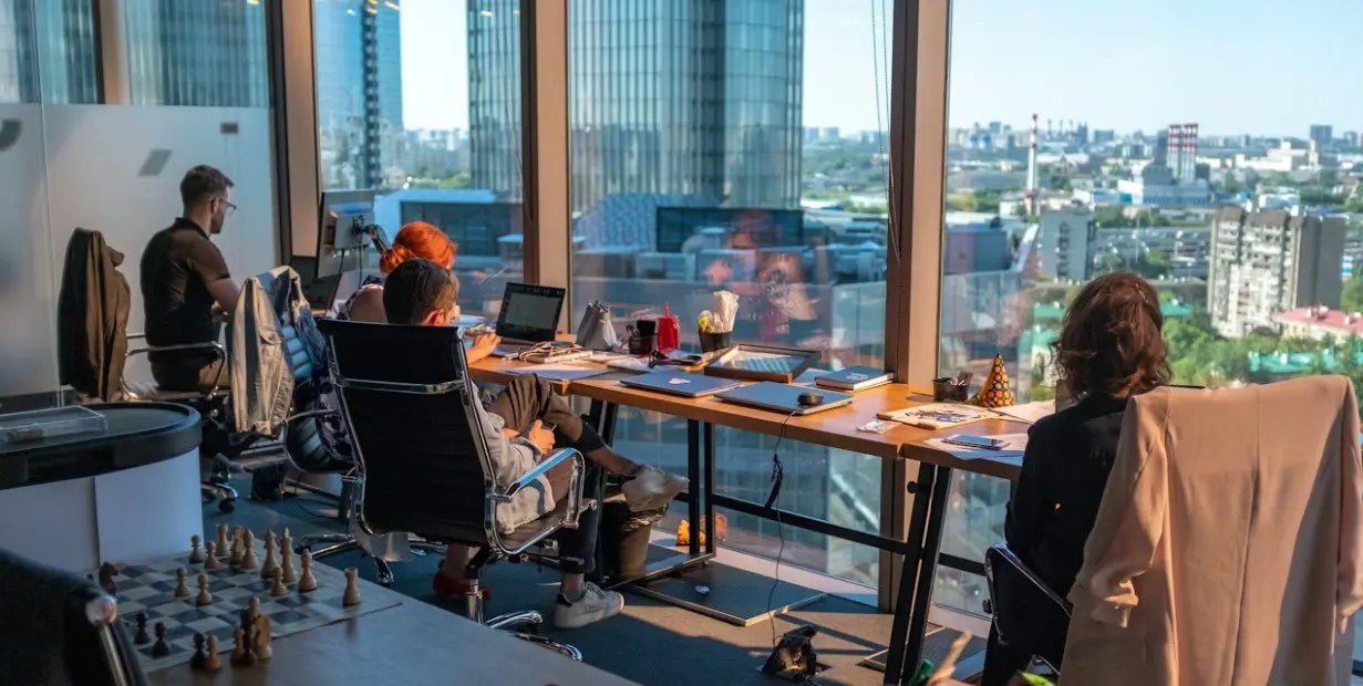 Young professionals working in a modern Gulf corporate office environment in 2026