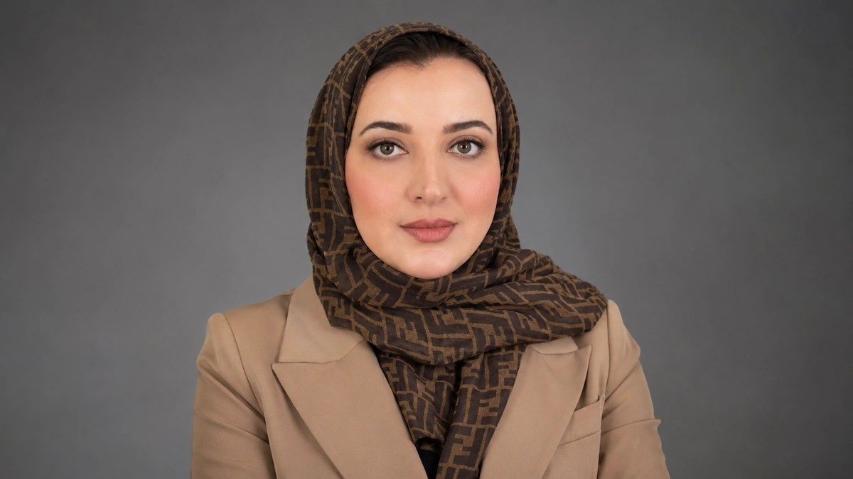 Layla Mukhtar, newly appointed Head of Internal Audit at Solidarity Bahrain, in a professional portrait against a grey background.