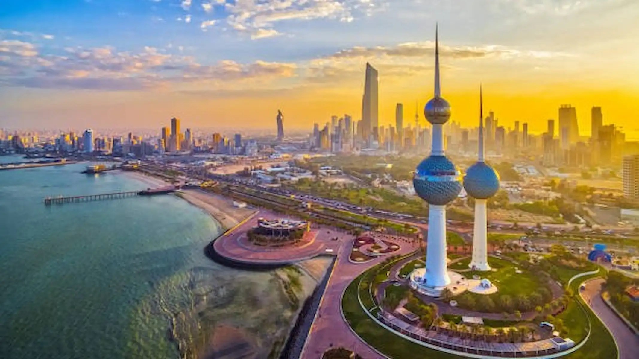 Kuwait City skyline with the iconic Kuwait Towers, representing Kuwait's business environment and the Municipality's business licensing awareness campaign.
