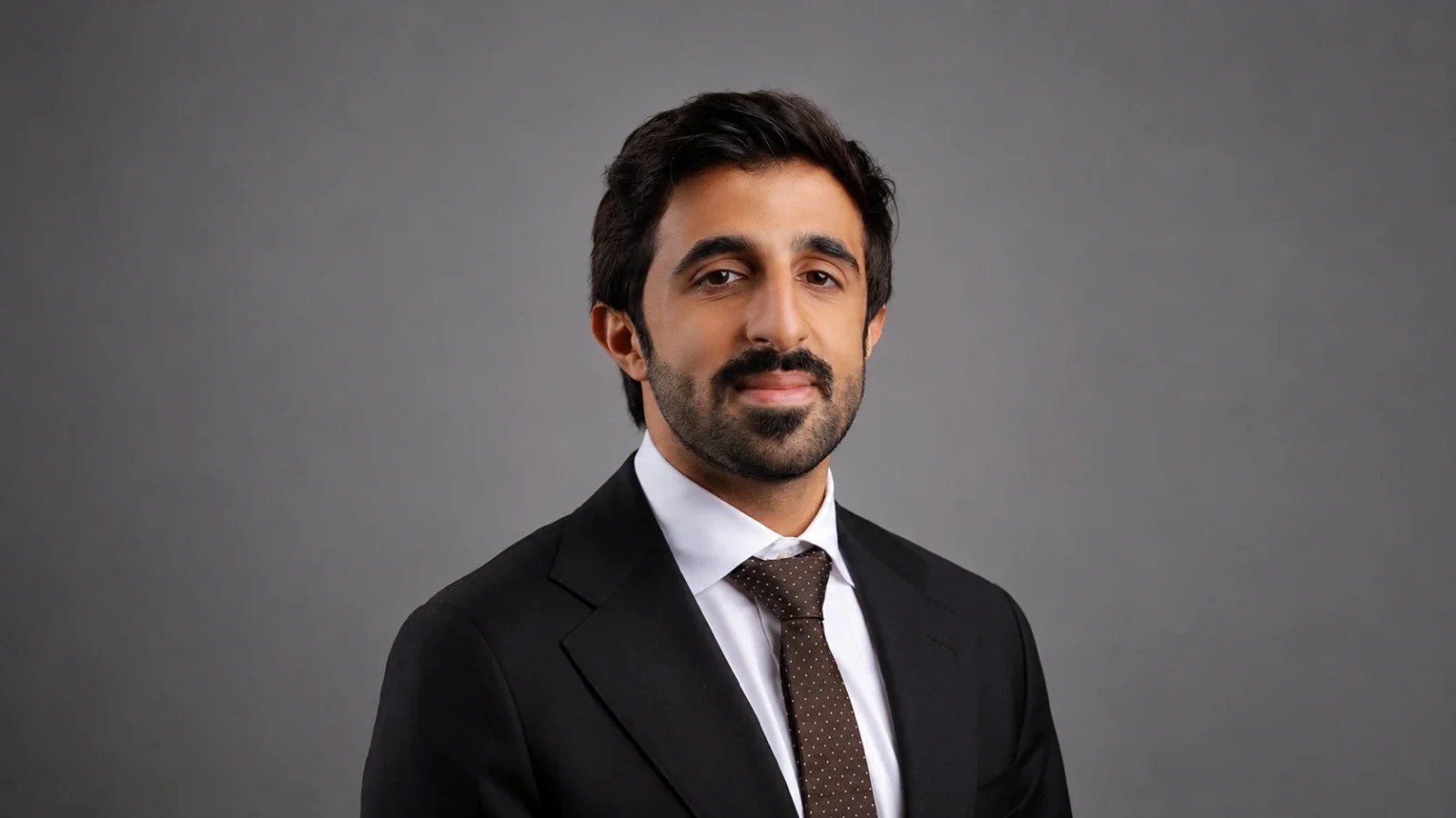 Portrait of Hesham Bucheeri, Legal Counsel at the National Bank of Bahrain and newly appointed Project Lead in the Legal Committee of the Bahrain Association of Banks (BAB).