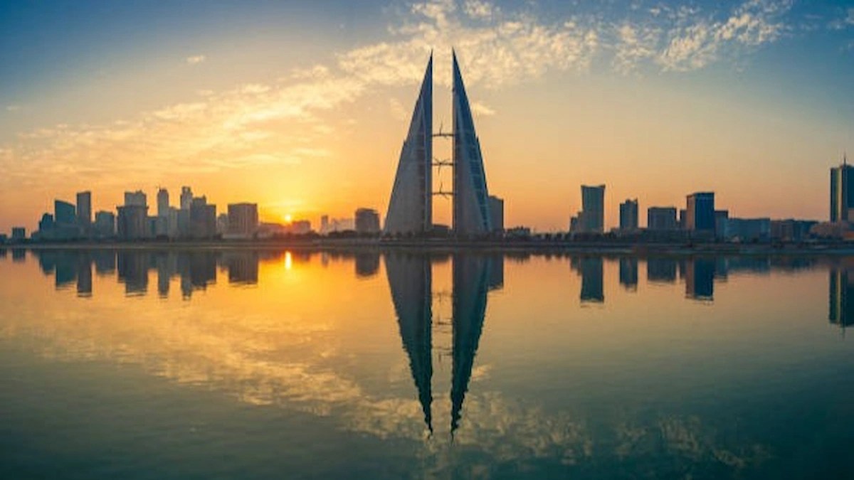 Bahrain skyline at sunrise, symbolising workplace wellbeing and employee health initiatives promoted by Muharraq Governorate.