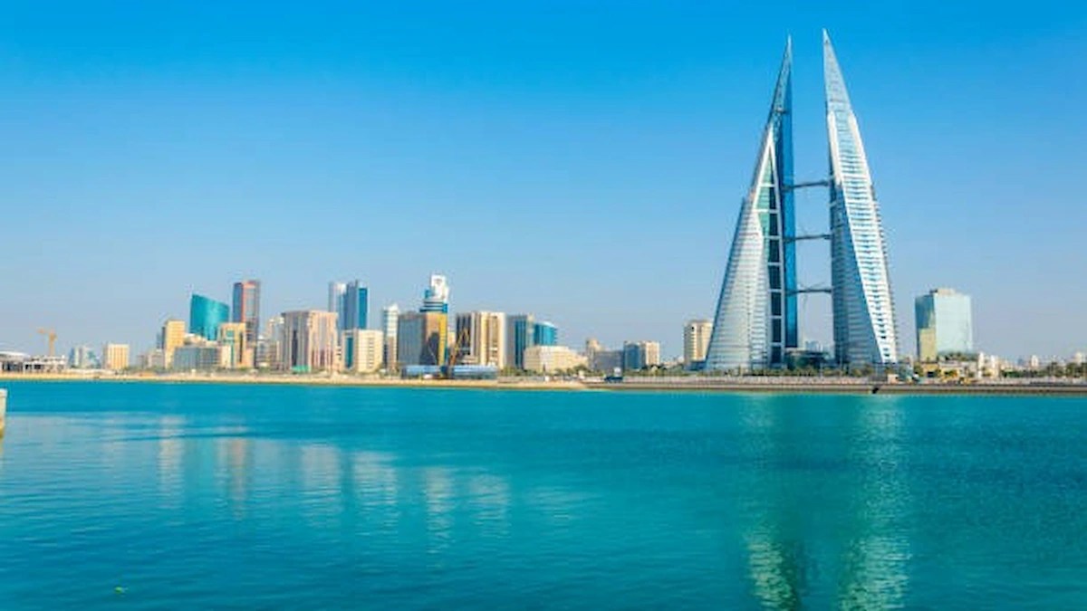 Bahrain skyline featuring the Bahrain World Trade Center, representing the country's commitment to worker welfare and summer safety initiatives.