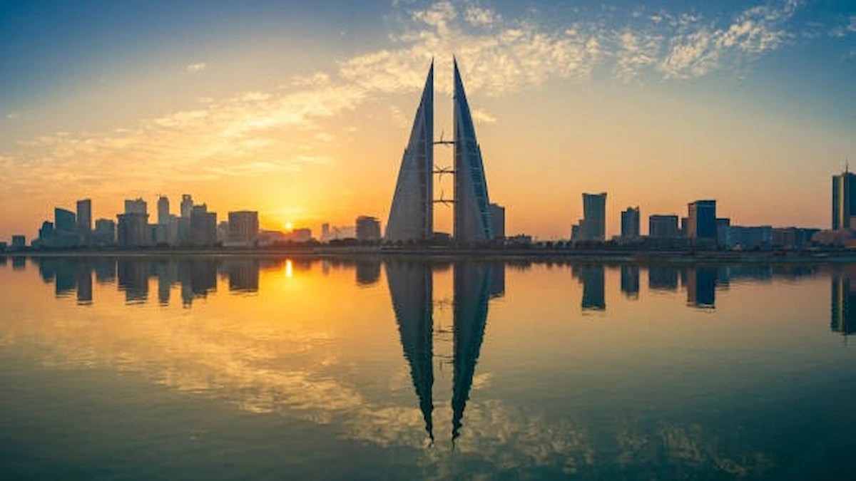 Bahrain skyline with the Bahrain World Trade Centre at sunset, representing Bahrain future skills and youth training.