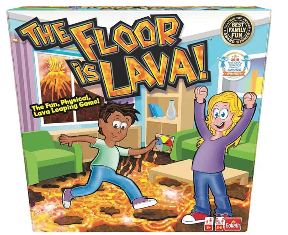 Kids playing "The Floor is Lava" game with a lava-themed mat and fun indoor setup.