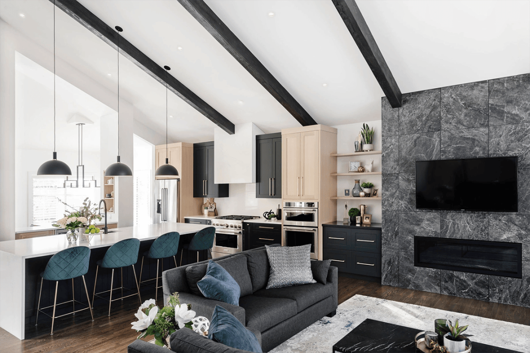 Modern open-plan living space with a kitchen, dining area, and lounge featuring contrasting light and dark decor elements, designed by an acclaimed Interior Design Calgary team studio ru