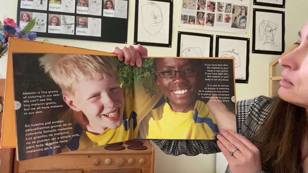 Illustration in a page on the book showing two happy children but with different skin colors
