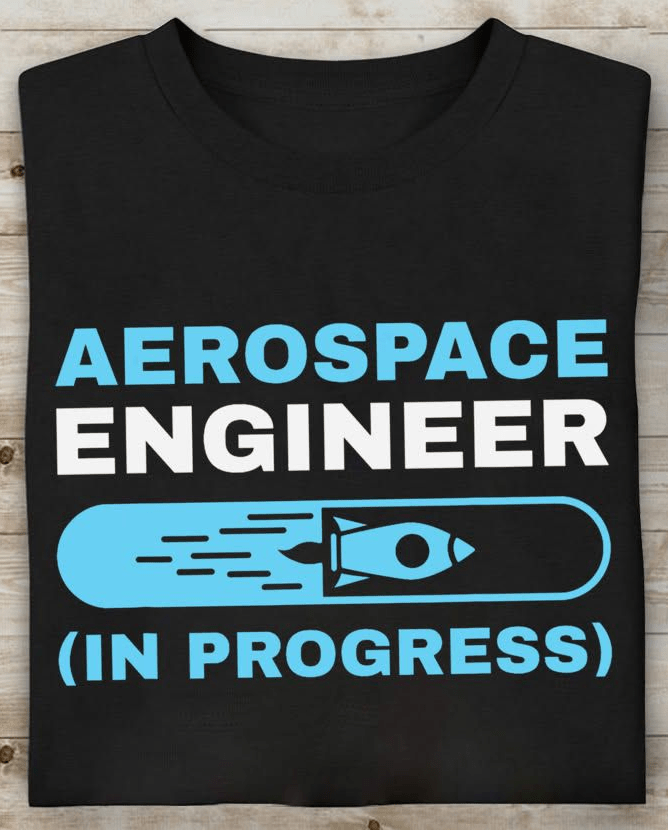 Aerospace engineer in progress t shirt worn by engineering student with space-themed design.