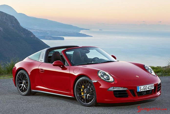 911 Targa 4 GTS and Cayenne Turbo S 2015 world premiere: The 2015 Detroit-Show reveal of a 911 red Targa 4 GTS, seen from its right-side view against a breathtaking coastal vista. Credit: PCNA