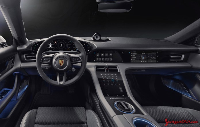 Credit: Porsche AG Porsche Taycan first electric sports car world premiere: The Taycan’s black-paneled dashboard is seen here with the optional passenger display screen. Credit: Porsche AG