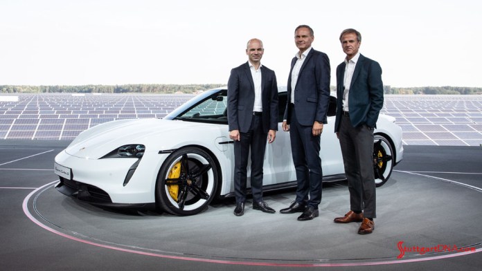 Porsche Taycan first electric sports car world premiere: Seen here is a white Taycan with Porsche executives at the Germany premiere. From left to right: Manfred Harrer Vice President Chassis Development; Oliver Blume, Chairman of the Executive Board of Porsche AG; and Michael Mauer, Vice President Style Porsche . Credit: Porsche AG