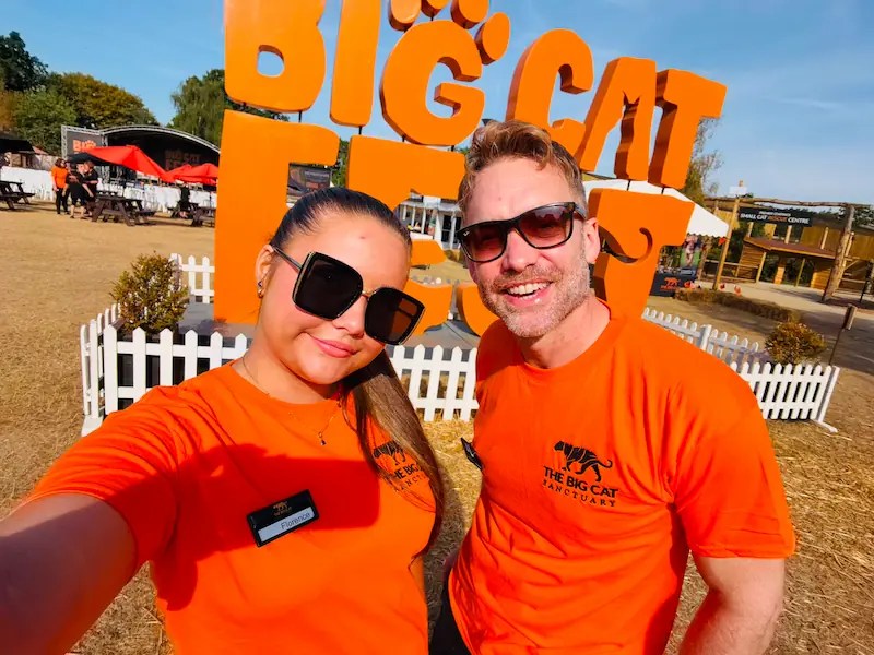 Daryl and Flo from Style Brands volunteering in front of the Big Cat Fest sign