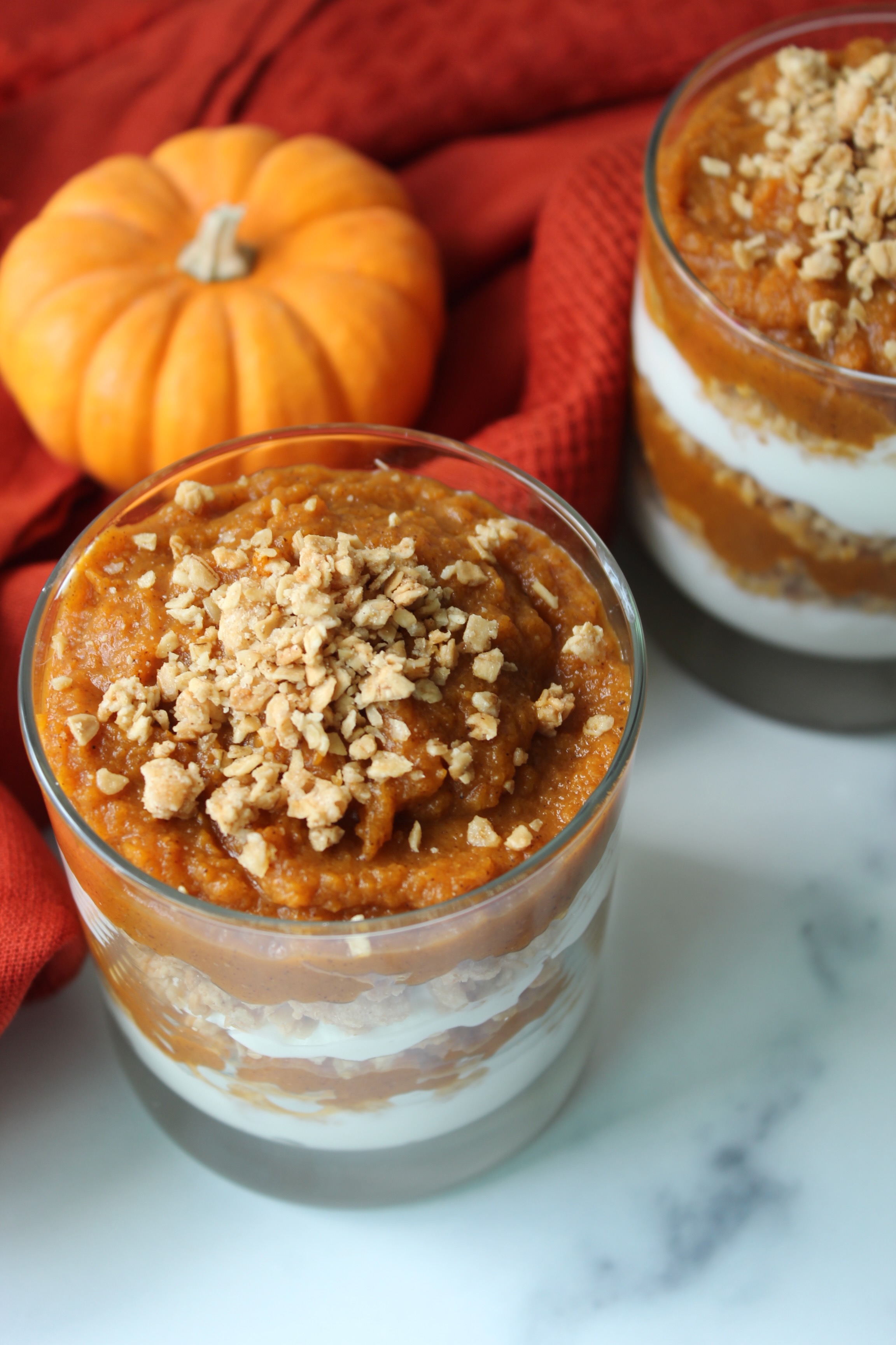 pumpkin parfait with mini pumpkin in background