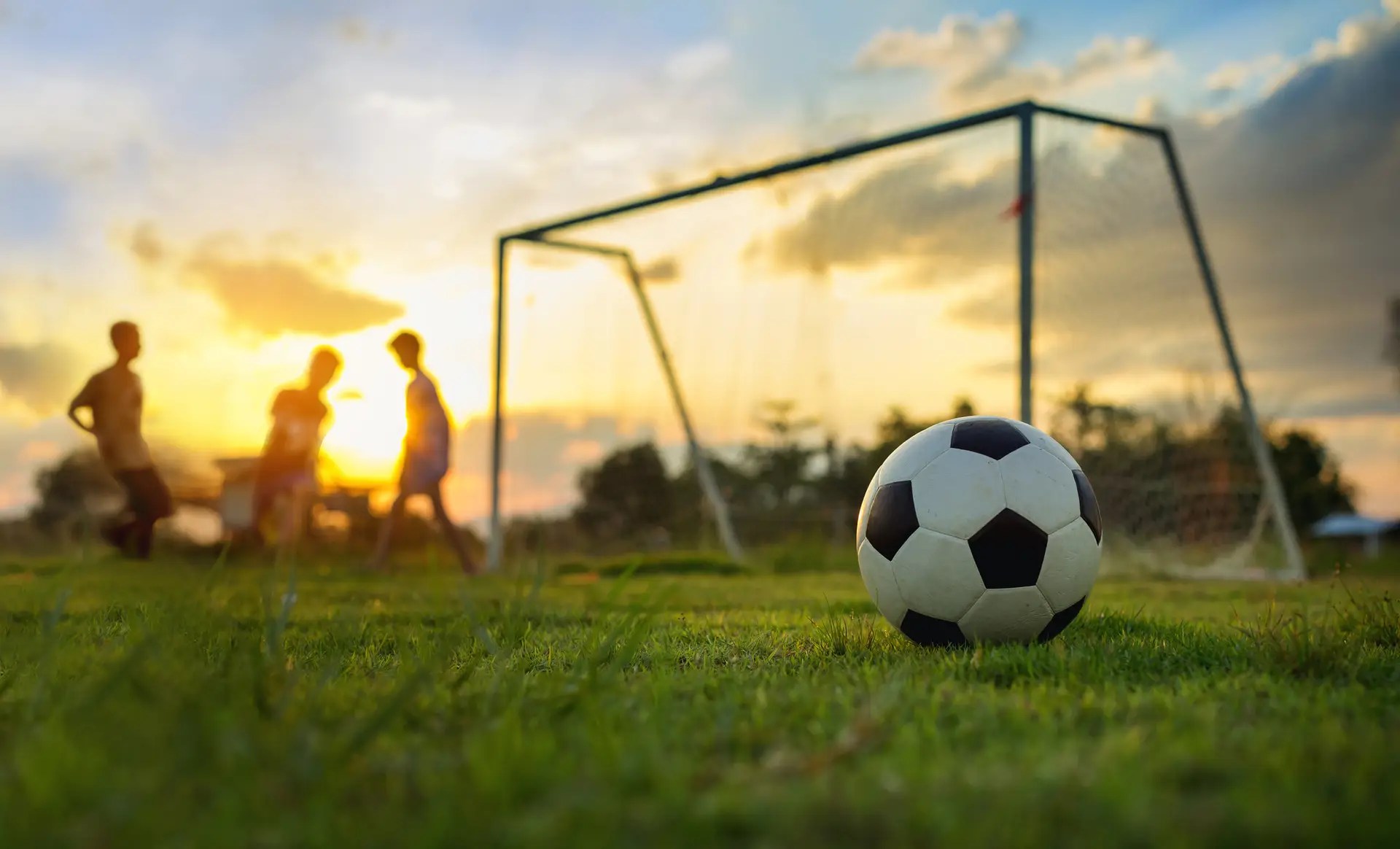 A random image of kids playing on a soccer field