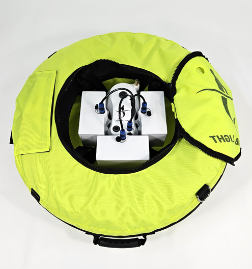 Sub Flight floating compressor with attached modular batteries, designed for surface air supply during diving.