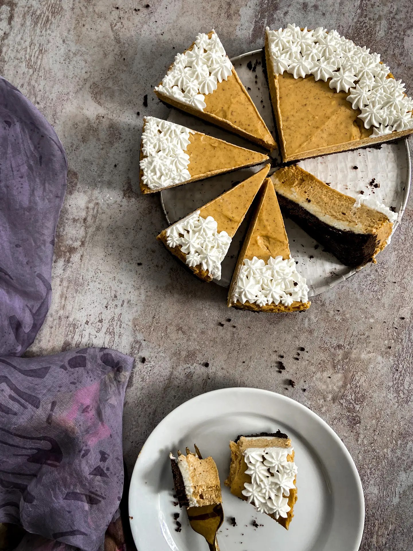 Layered pumpkin cheesecake with caramel drizzle