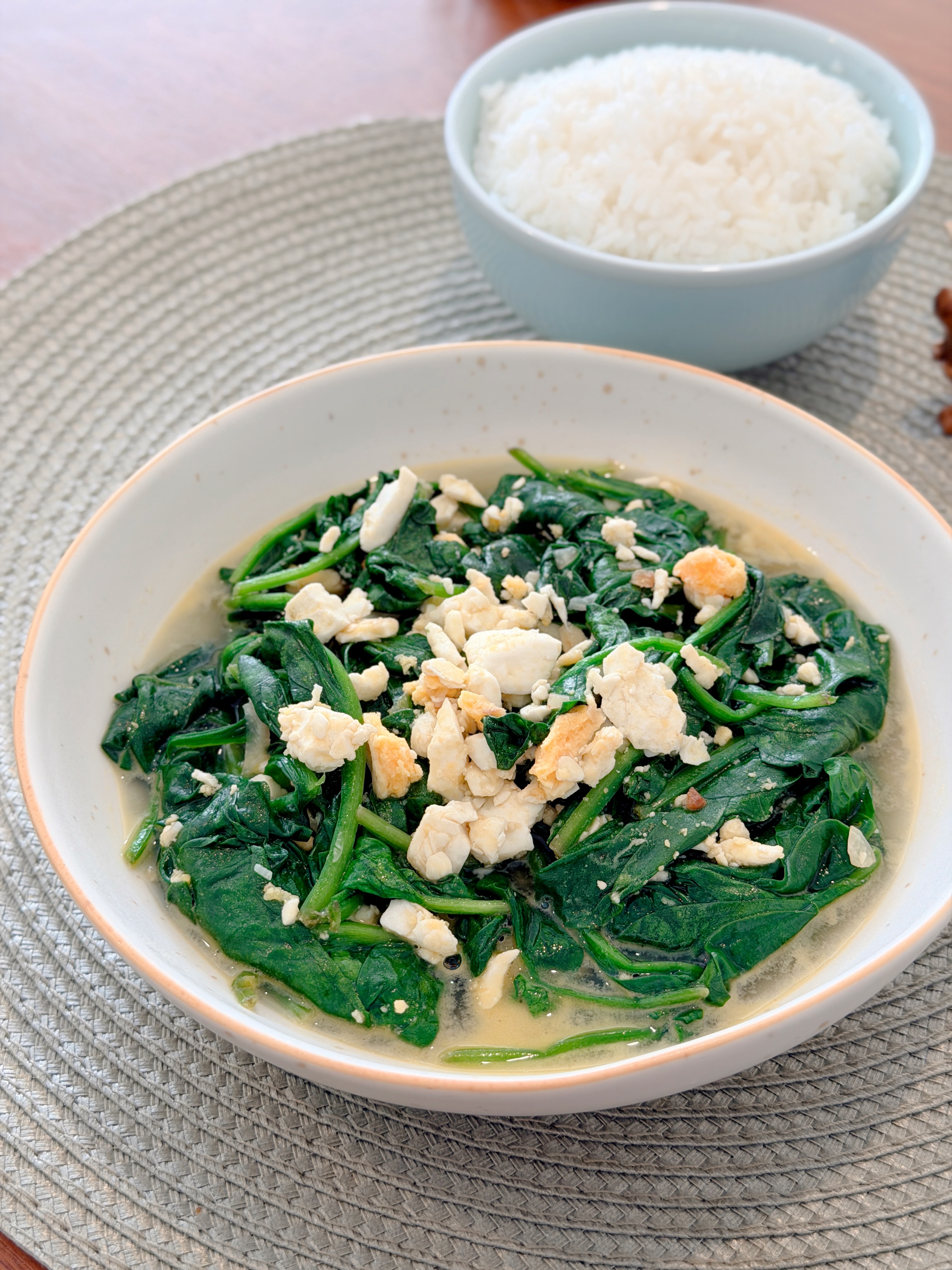 Spinach in Salted Egg Broth 鹹蛋浸菠菜 served in a bowl with steamed rice