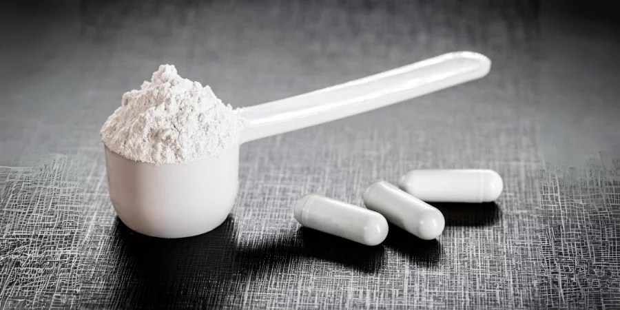 Does Creatine Cause Acne? Debunking Myths and Revealing Scientific Facts 3 scoop with creatine monohydrate and creatine monohydrate caps