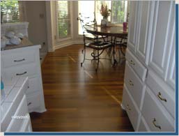 Cumaru hardwood flooring in a bright dining area.