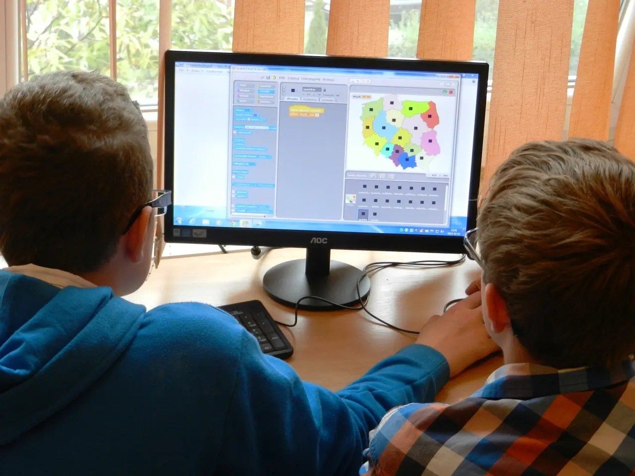Students engaging in self-directed digital learning and online education software