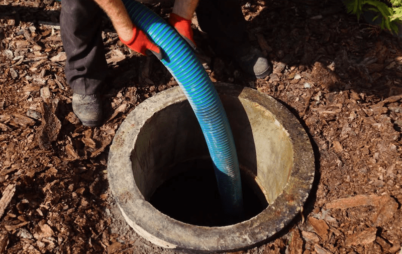 Worker_Cleaning_Surefire_Septic
