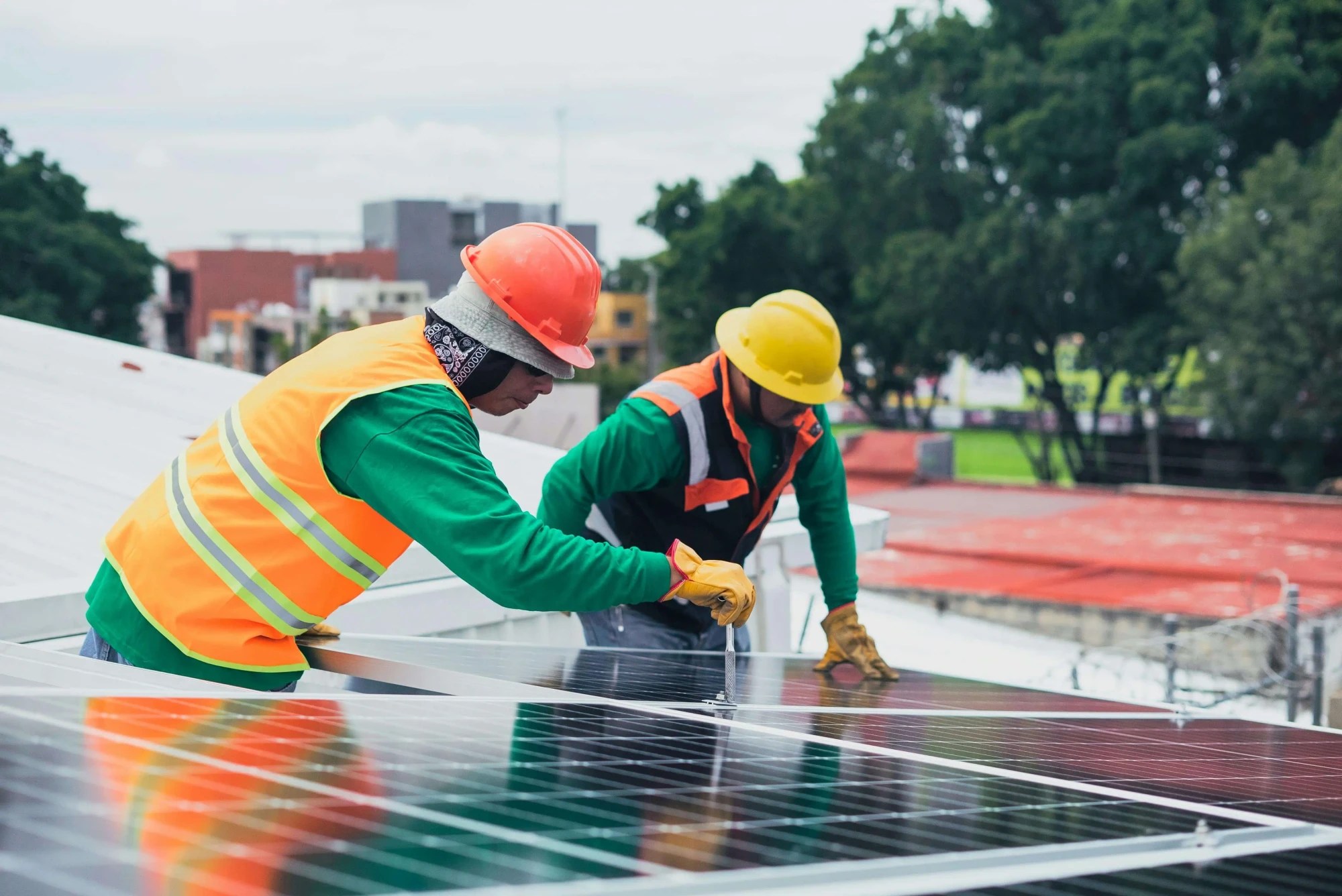 TECHNICIAN INSTALLING SOLAR PANLE IN HOME
